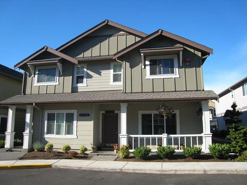Two Stories with a two car garage and two more parking spaces on property.