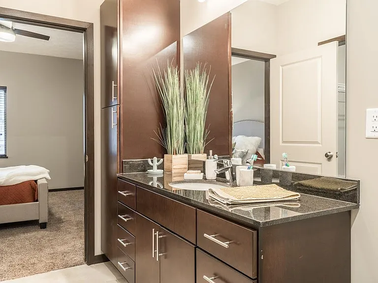 Our bathrooms feature modern hardware, granite countertops and ample storage.
