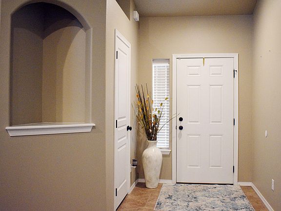 Front entry with coat closet and wall nook