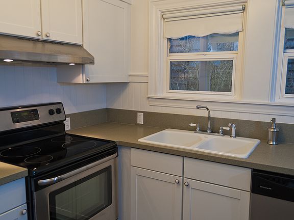 Newly finished kitchen with slab counters.