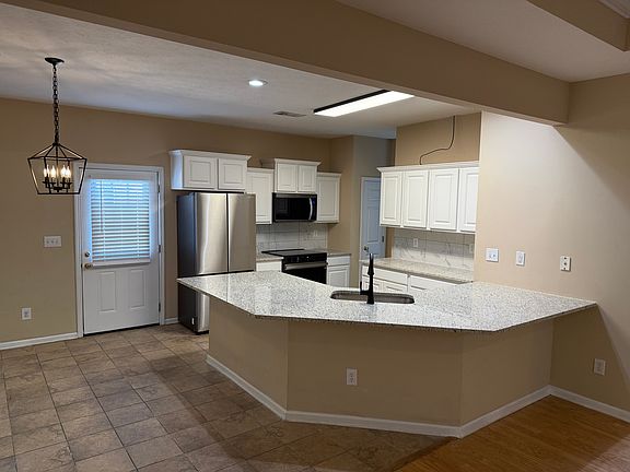 Updated kitchen with brand new refrigerator, range, and microwave