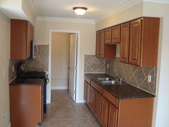 Granite counters with tile back splash. Laundry connections