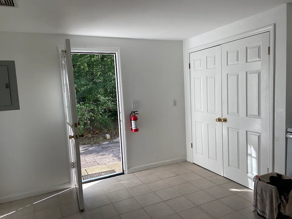 Entry from kitchen. Laundry closet on right and BR 1 is to the left (door is out of view)