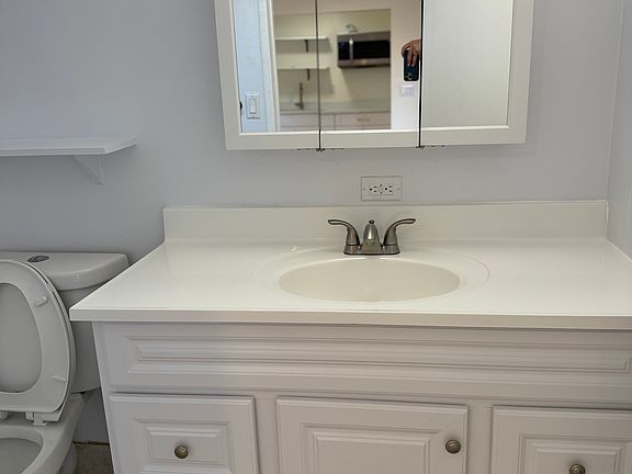 Brand new medicine cabinet, sink, and cabinet vanity. Brand new paint on the walls.