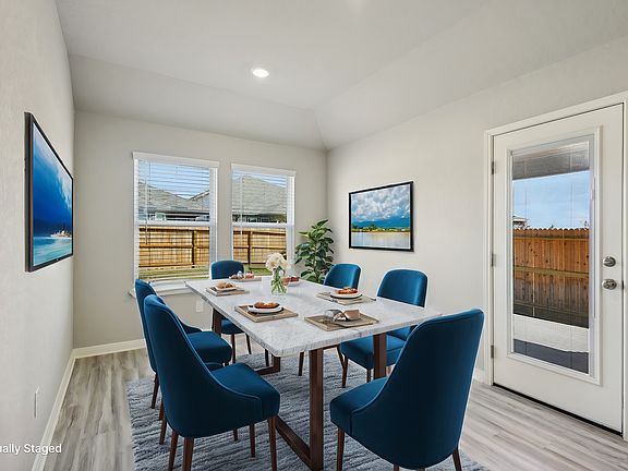Virtually staged dining room in the Callaghan floorplan at a Meritage Homes community.