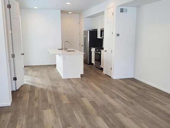 Kitchen with modern cabinets, countertops, and appliances