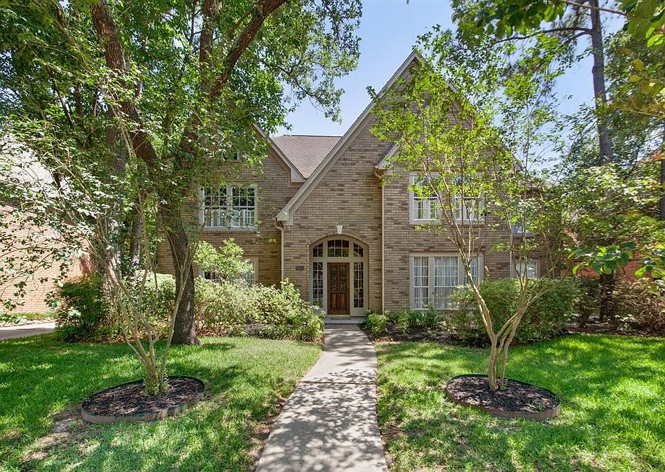 A classic beauty, the repeated steep gable ends keep a low and elegant profile for this spacious home.