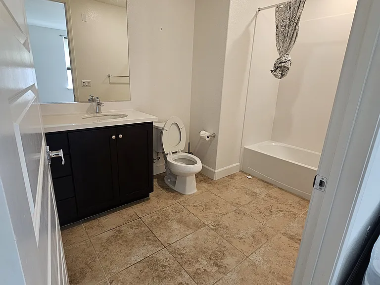 First floor bedroom's ensuite: shower toilet, sink