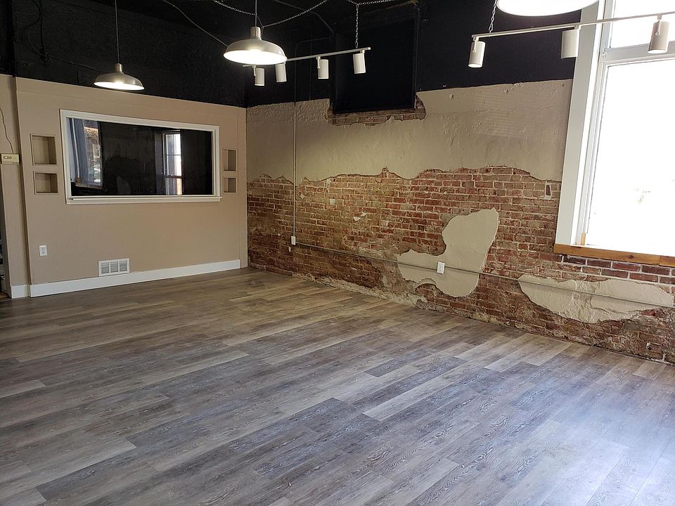 Other angle of Living room. Window is thru to bedroom. Tinted so can only see out of bedroom into LIving room. Unless light is on in bedroom. unfinished view but a pantry area has been installed that now covers windoe to bedroom.