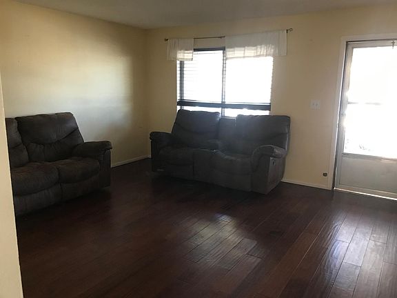 Entry room/living room furnished with recliner couches