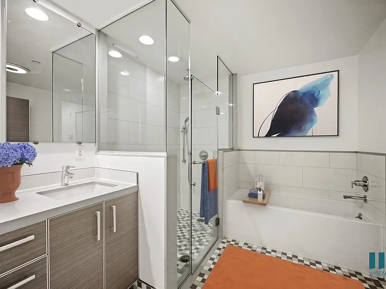 Bathroom with a Walk-In Shower, Full-Size Bathtub, and Double-Sink Vanity with Cabinet Storage