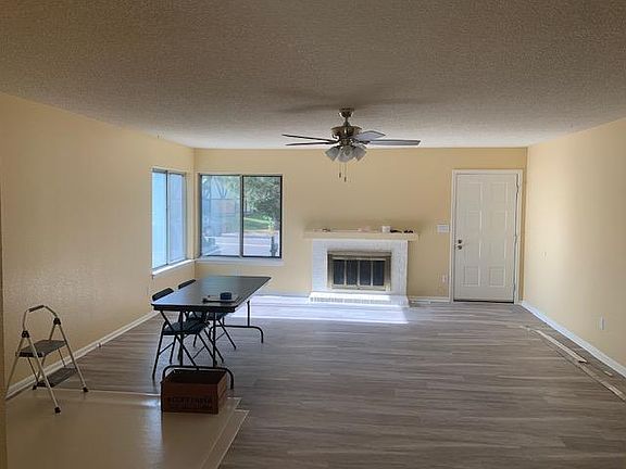 Living room with fireplace view from kitchen