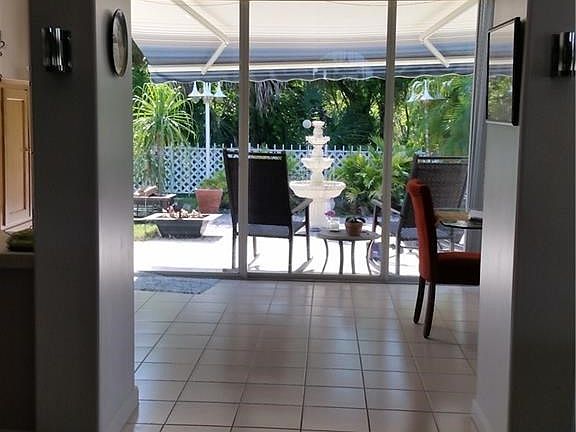 Retractable awning over patio.