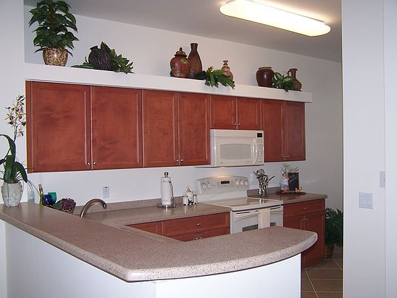 LOADS of gorgeous cabinets and nice pantry in this kitchen!