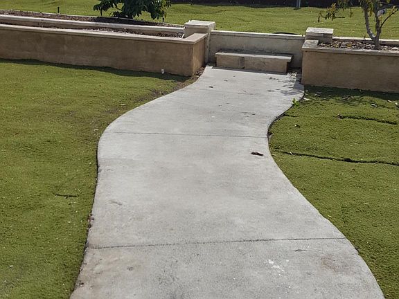 Large, quiet, backyard with artificial turf.