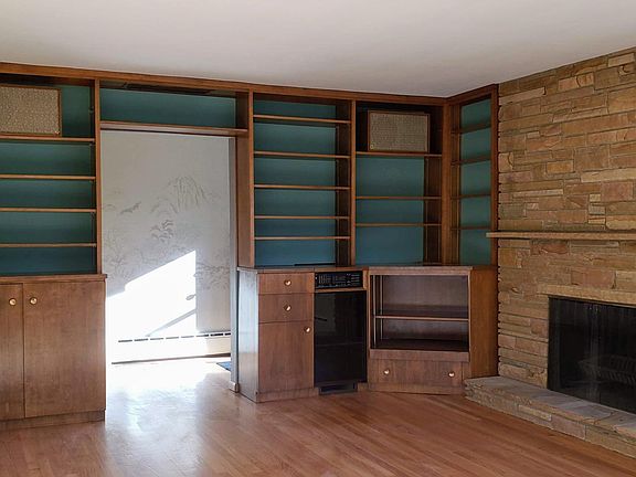 Living room with lots of built-ins and storage.