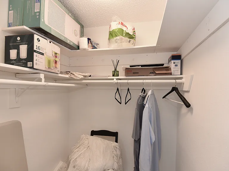Walk in closet in Bedroom 1 (carpeted)