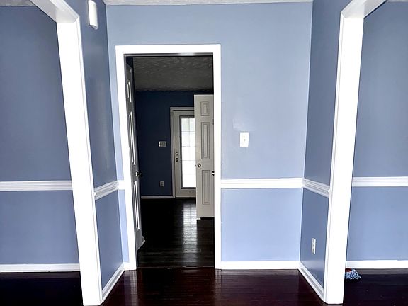 Foyer with formal living and dining room entrances