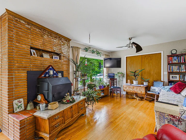 MAIN LEVEL: Living Room with Fireplace Insert (Front Door to left, Dining Room to right)