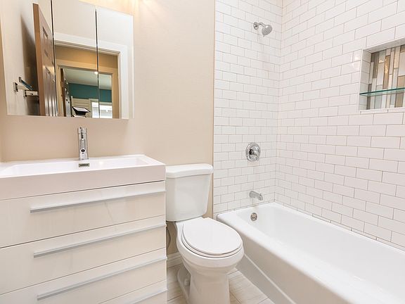 Brand-new bathroom with skylight and high ceilings