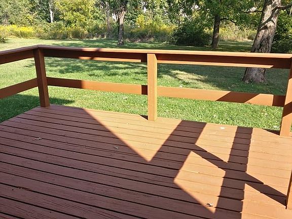large back deck attached with door into kitchen