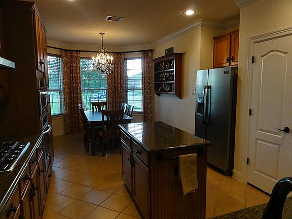 Looking into the kitchen from the dining area.