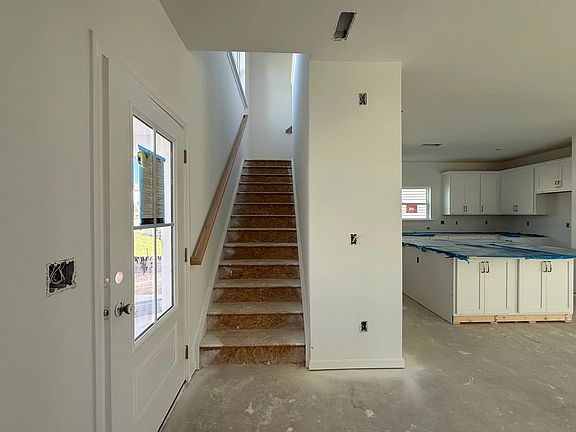 Staircase featuring the AW Collection R Timeless - Classic rails and trim add graceful detail.