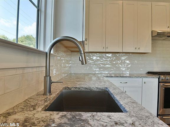 Under mount sink, lots of cabinets for storage.