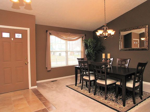 The dining room is very spacious, with new neutral carpeting throughout.