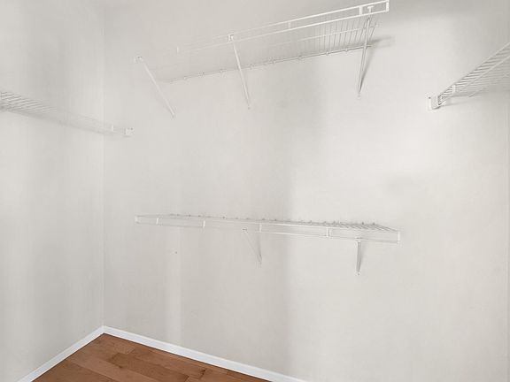Main closet in the main bedroom showing extensive hanging space.