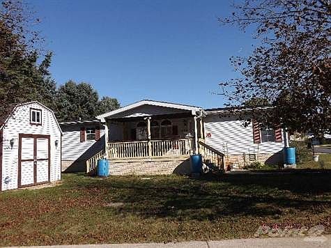 Rear view of home showing new Kohler Natural Gas Generator.