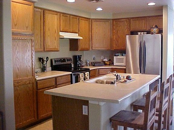KITCHEN WITH BREAKFAST BAR THAT OPENS TO FAMILY ROOM!