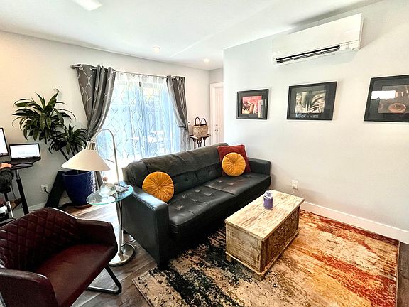 Lots of natural light, leather fold-out sofa (queen), adjustable desk, Steal-Case office chair