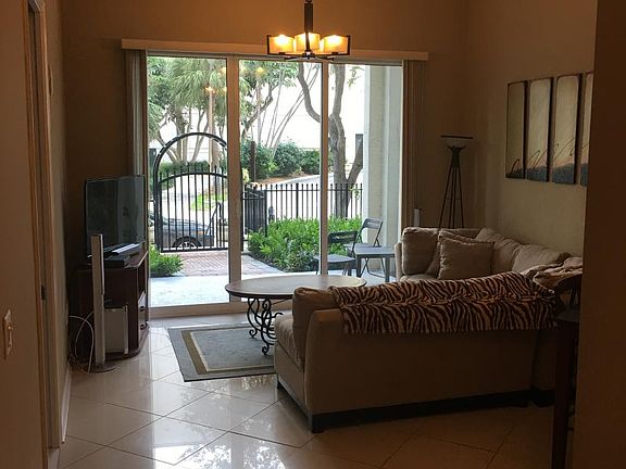 Living room with high ceilings (throughout)