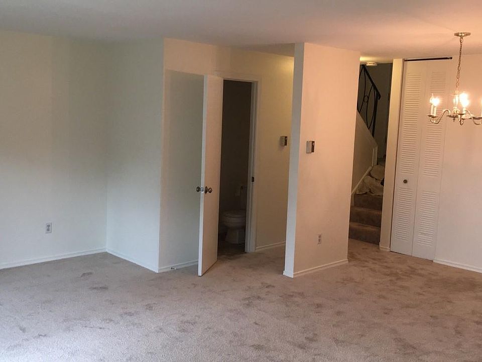 Living Room. View of Coat Closet and Half Bath. Temperature controls on Wall.