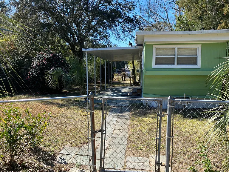 Fenced yard with gate to walkway