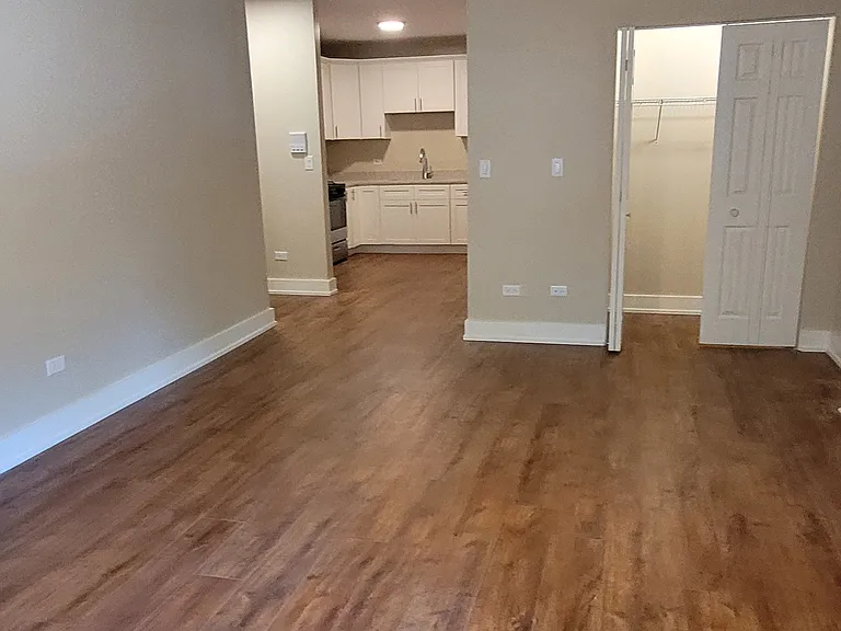 View from he front Bay window all the way to the kitchen. Note the large Living Room Closet.