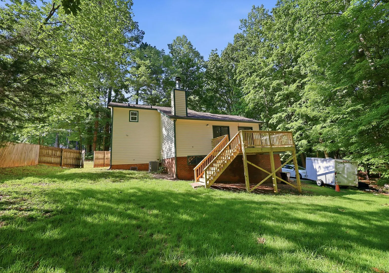 Wooded Retreat with Acreage, Two-Car Garage & Google Fiber. 4- 12 month lease option! — Photo 2