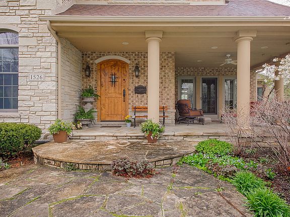 Gorgeous flagstone steps that continue to porch an