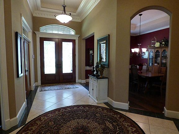 Grand Entry with views of the Family Room, Study and Formal Dining.