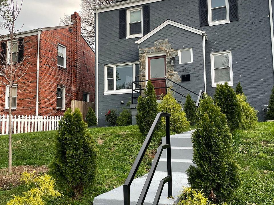 Exterior front located on a quiet, clean street in a family-friendly neighborhood. Up on a hill off the street adds to the privacy.