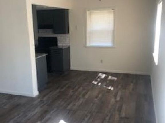Living Room newly remodeled, wood look flooring and new paint.