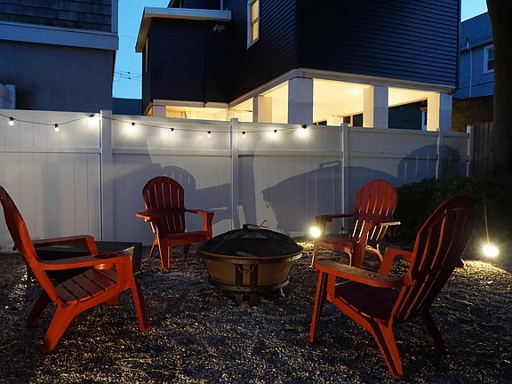 Private fenced in backyard with firepit & bbq grill