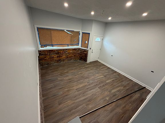 In final stages of renovation - Large great room with brand new windows & lots of natural light