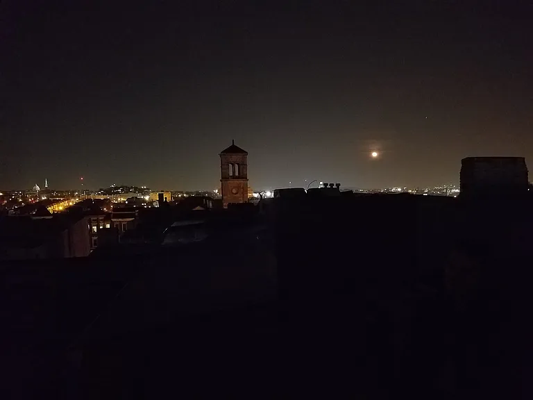 Night view out kitchen window, Basilica on left. (Now partially obscured by air conditioners next door.)