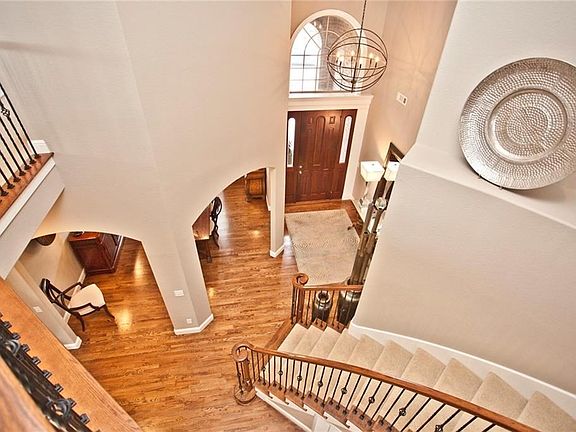 GRAND Entry welcomes your guests. Upgraded light fixtures throughout. Gleaming hardwood floors and fresh paint colors make this home bright and inviting.