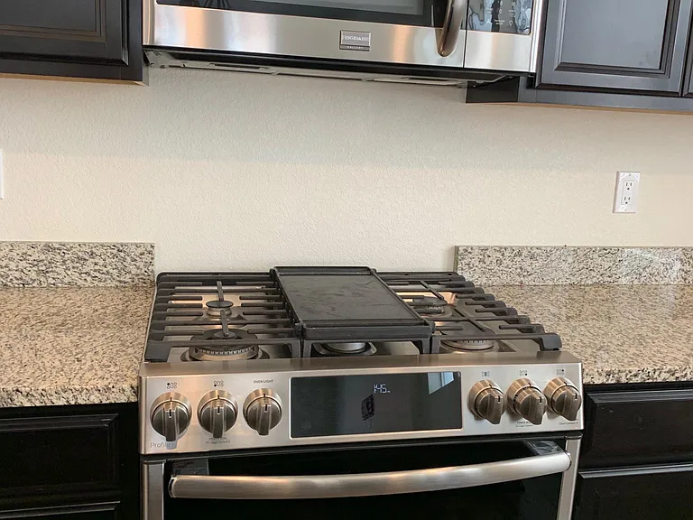 Microwave, Gas Range/electric oven, tall upper cabinets and closet style pantry