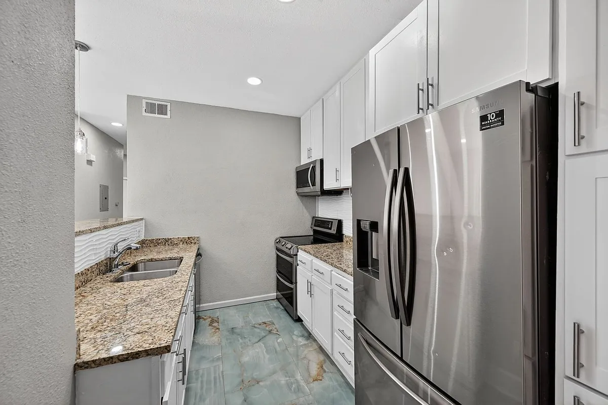 Building Photo - 10784 W 63rd Pl #208