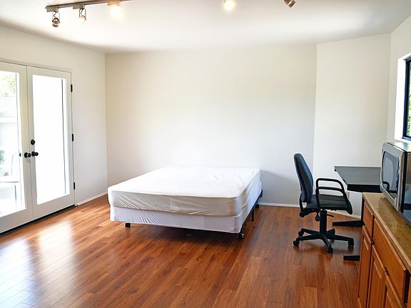Interior view 2 , queen bed, desk/chair, kitchen table w/2 chairs