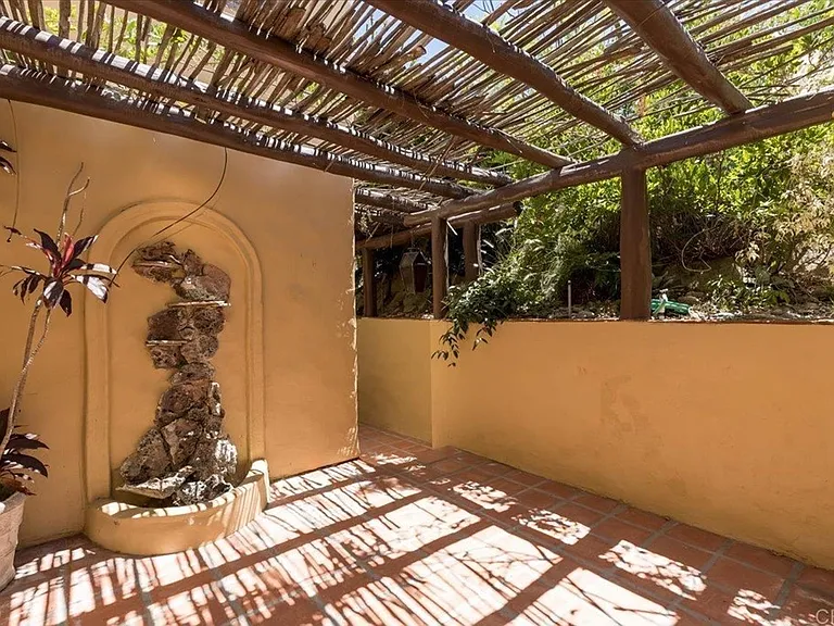 Back patio outside the kitchen is cool and shady.